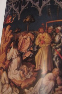 Red-headed Judas leads the soldiers to Jesus in Gethsemane.